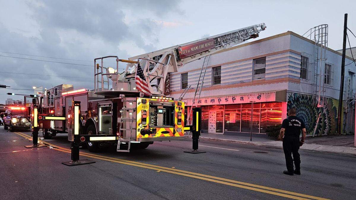 Firefighters tend to a fire at Design District restaurant Square Pie City.
