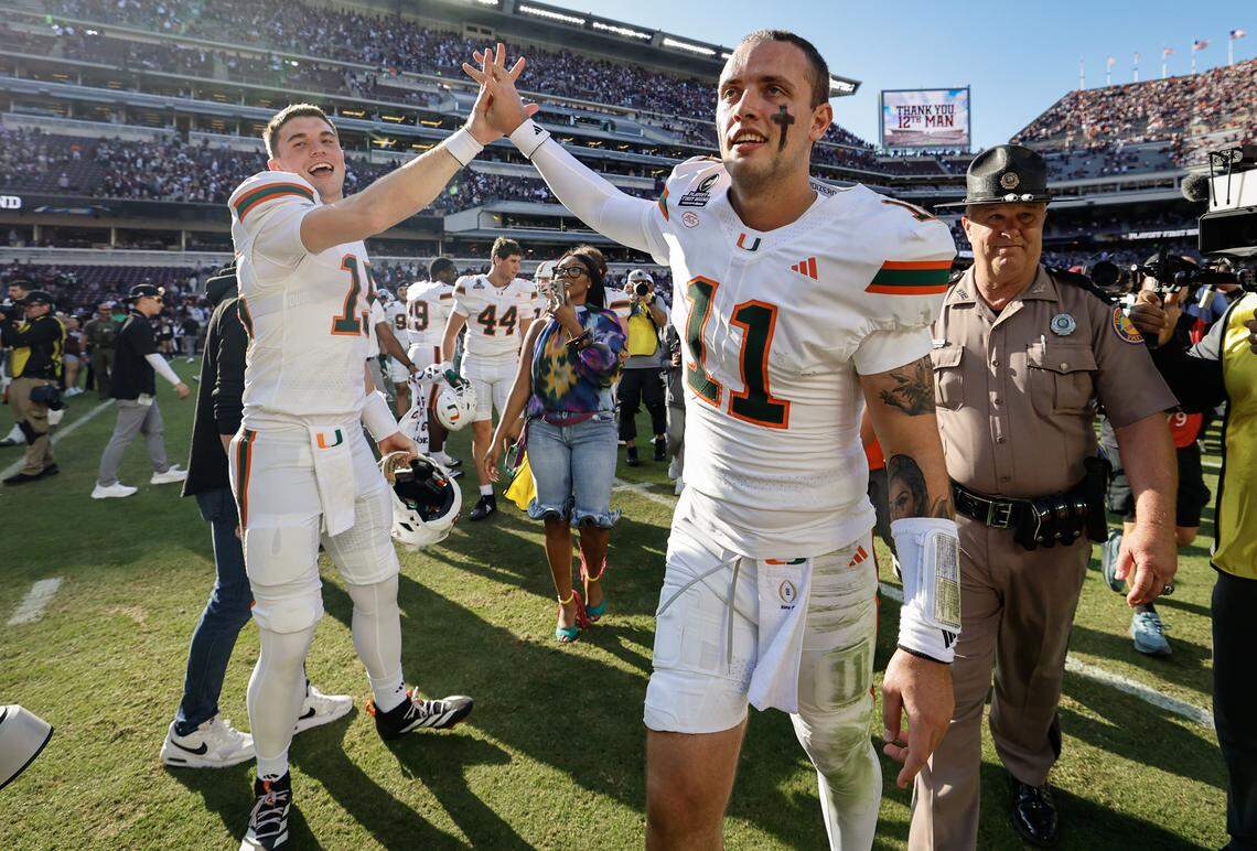 Miami Hurricanes quarterback Carson Beck (11) and quarterback Judd Anderson (15) celebrate after defeating the Texas A&M Aggies in the first round of the 2025 College Football Playoff at Kyle Field at College Station, Texas, on Saturday, December 20, 2025.