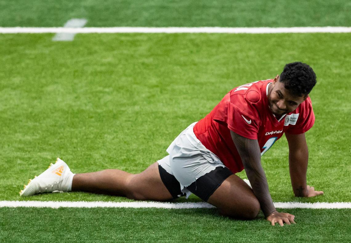 Miami Dolphins quarterback Tua Tagovailoa (1) stretches during team practice at the Baptist Health Training Complex on Wednesday, Sept. 13, 2023 in Miami Gardens, Fla.