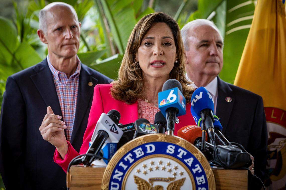 U.S. Reps. Maria Elvira Salazar, center, and Carlos Gimenez, right, standing with Sen. Rick Scott, are among those thought to be targeted by Cuba’s election meddling.