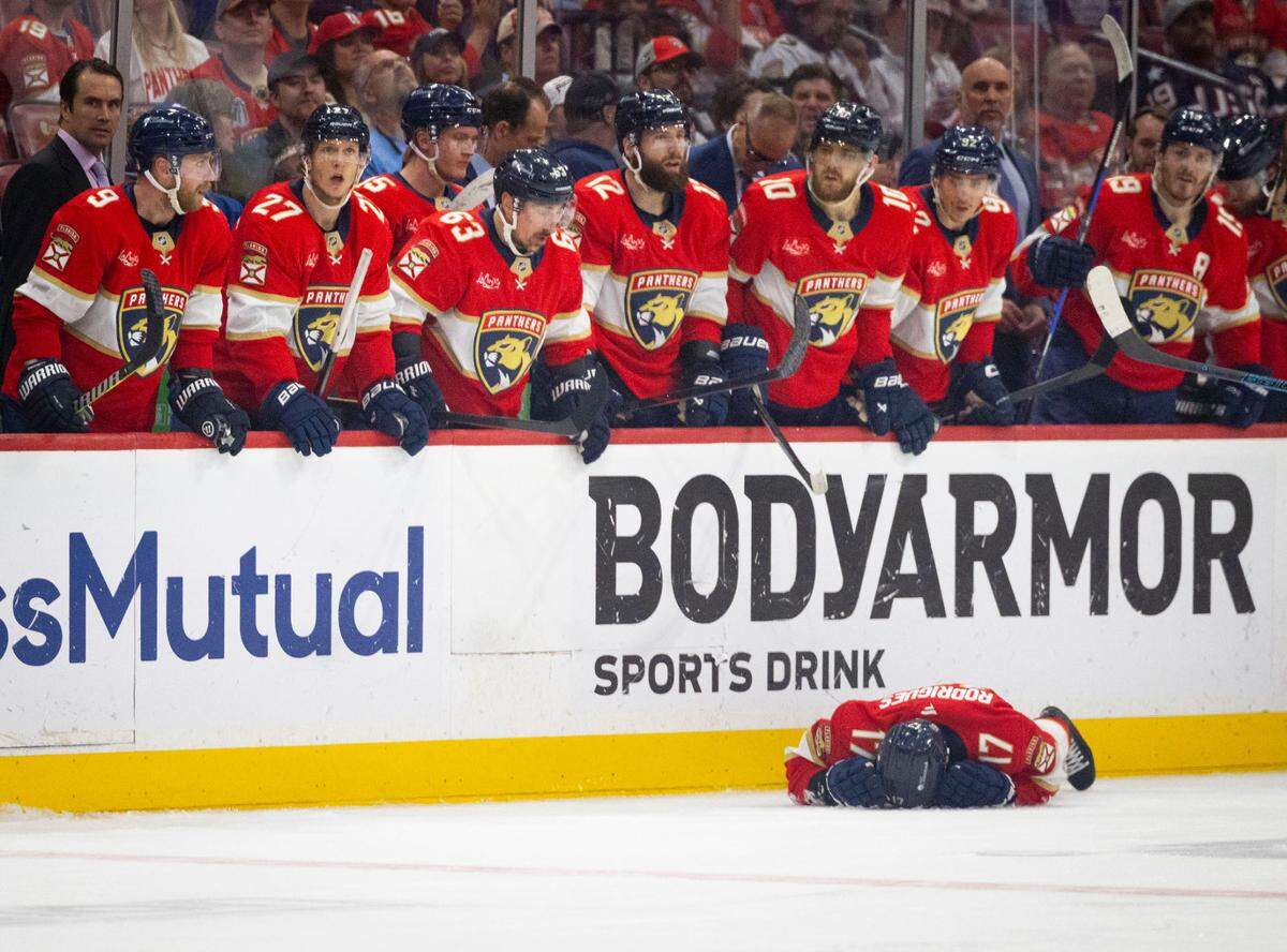 Florida Panthers center Evan Rodrigues (17) lays on the ground after being hit by Toronto Maple Leafs defenseman Oliver Ekman-Larsson (95) during the third period of Game 4 of a Stanley Cup playoffs second-round series on Sunday, May 11, 2025, at Amerant Bank Arena in Sunrise, Fla. The Florida Panthers won 2-0.