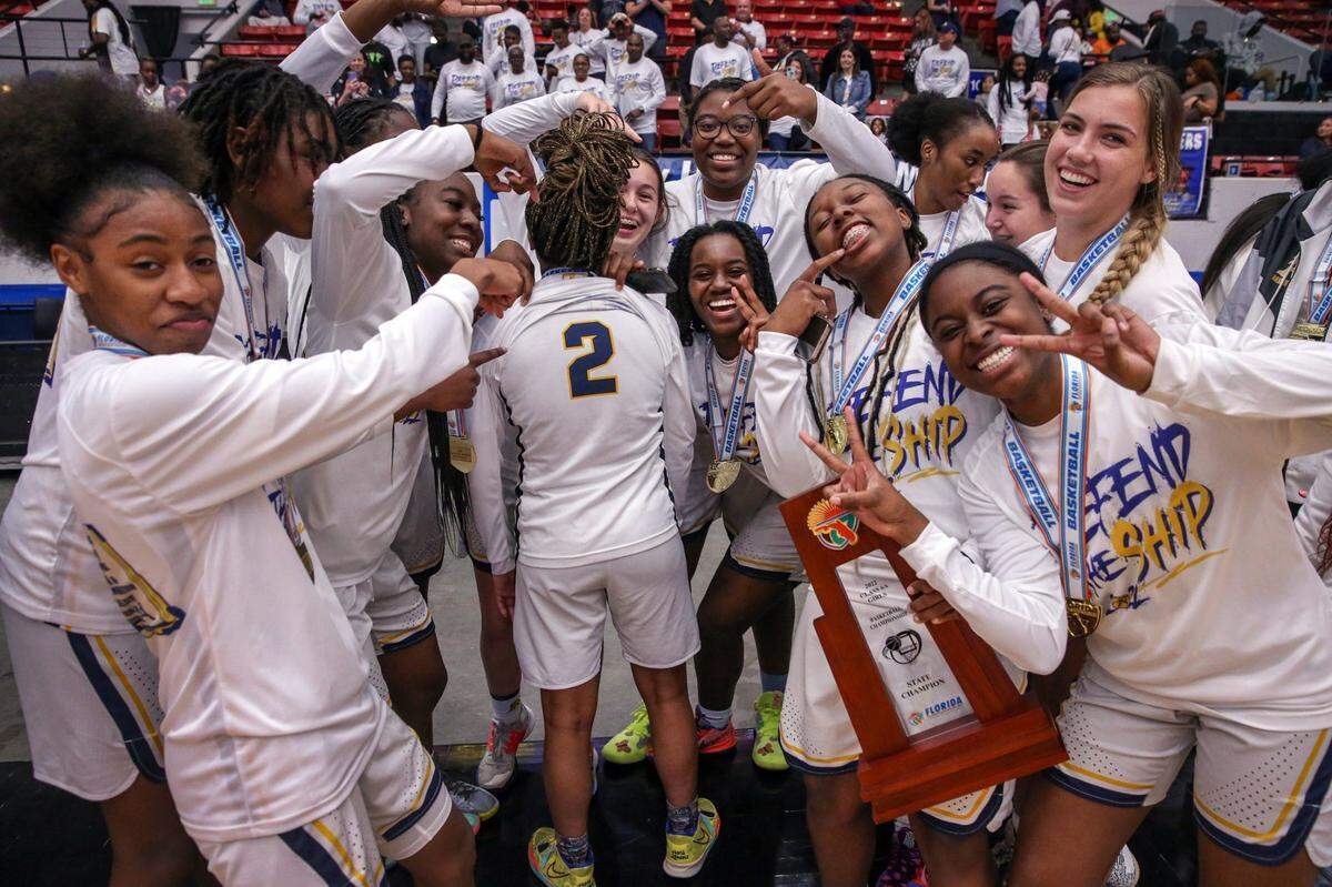 St. Thomas Aquinas celebrates their second consecutive state title after defeating Wekiva High in the Class 6A girls basketball state championship at the RP Funding Center in Lakeland on Saturday, February 26, 2022.