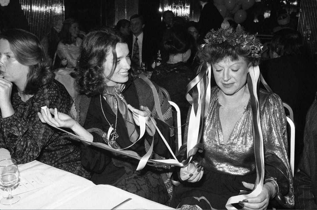 Margaret Trudeau, left, has ribbons held to her head by nightclub owner Regine at Regine’s club in New York, Friday, Jan. 13, 1978. The club was celebrating the Russian New Year and Regine was seeing how Margaret Trudeau would look in a Russian costume. (AP Photo/Richard Drew)