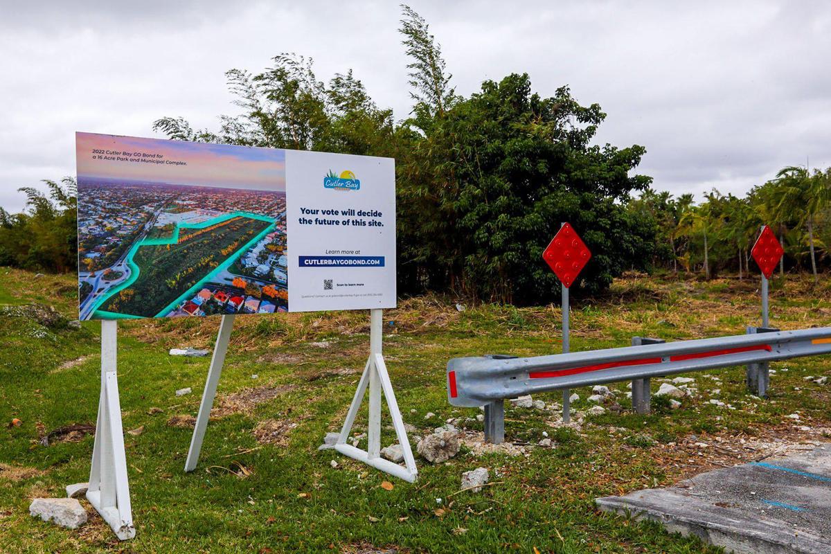 A roadside sign in Cutler Bay stands at the edge of a 16-acre plot of former farmland that the town wants to convert into a park and municipal center. The sign urges voters in the South Miami-Dade County town to cast ballots in a mail-in referendum authorizing the town to raise up to $37 million for the project. Voters on Tuesday approved the project.