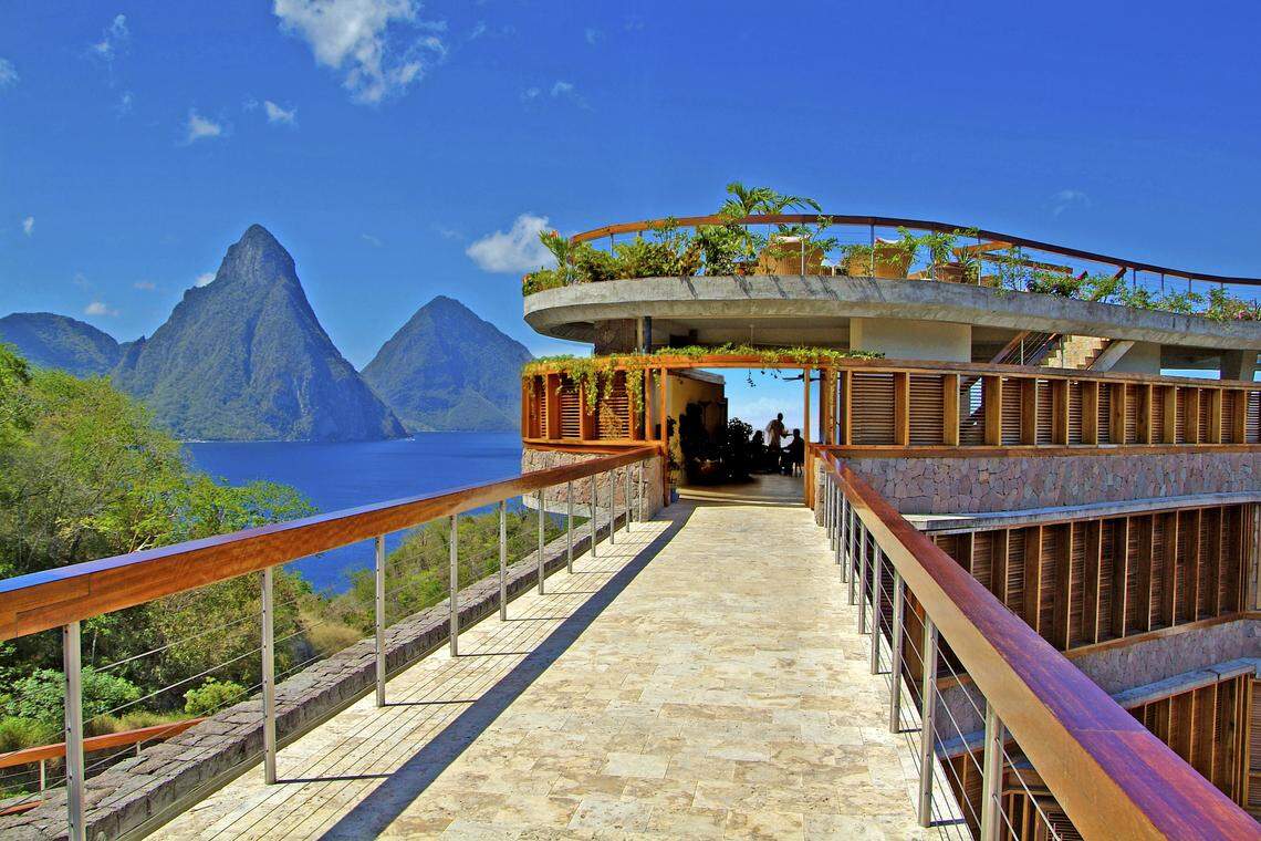One of the many tourist attractions of St. Lucia, the Jade Mountain Club, with a view of the island’s famous peaks, the Pitons.