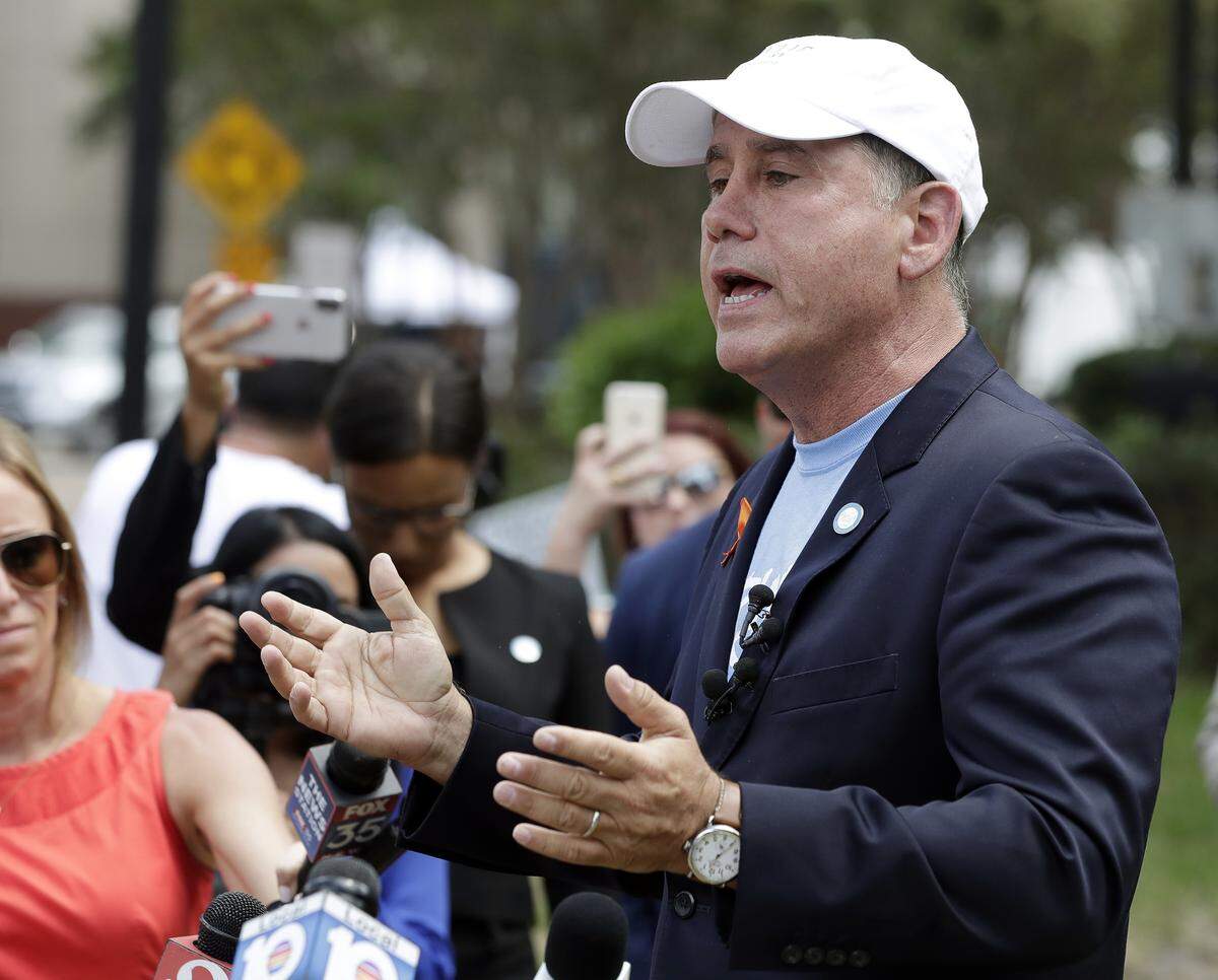 Florida Democratic gubernatorial candidate Philip Levine talks to members of the media Monday, Aug. 27, 2018, near the scene of a mass shooting at The Jacksonville Landing.
