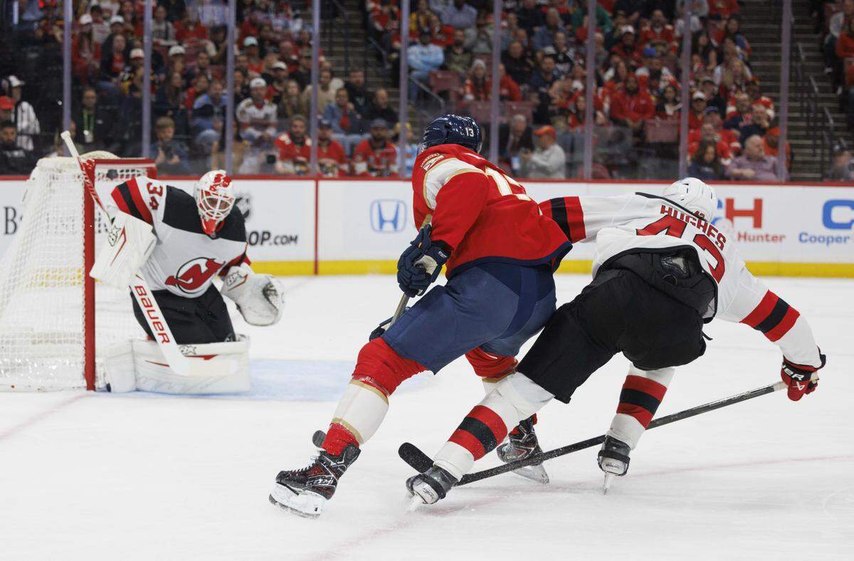 Florida Panthers center Sam Reinhart (13) scores a goal on New Jersey Devils goaltender Jake Allen (34) during the first period of a game on Thursday, Nov. 20, 2025, at Amerant Bank Arena in Sunrise, Fla.