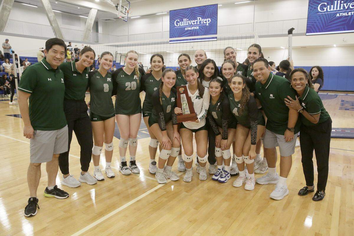 Pine Crest Panthers players and coaches pose for the picture after winning the Region 4-3A final volleyball game against Gulliver Raiders on Tuesday, October 28, 2025 at Gulliver Prep in Miami. Andrew Uloza / for Miami Herald
