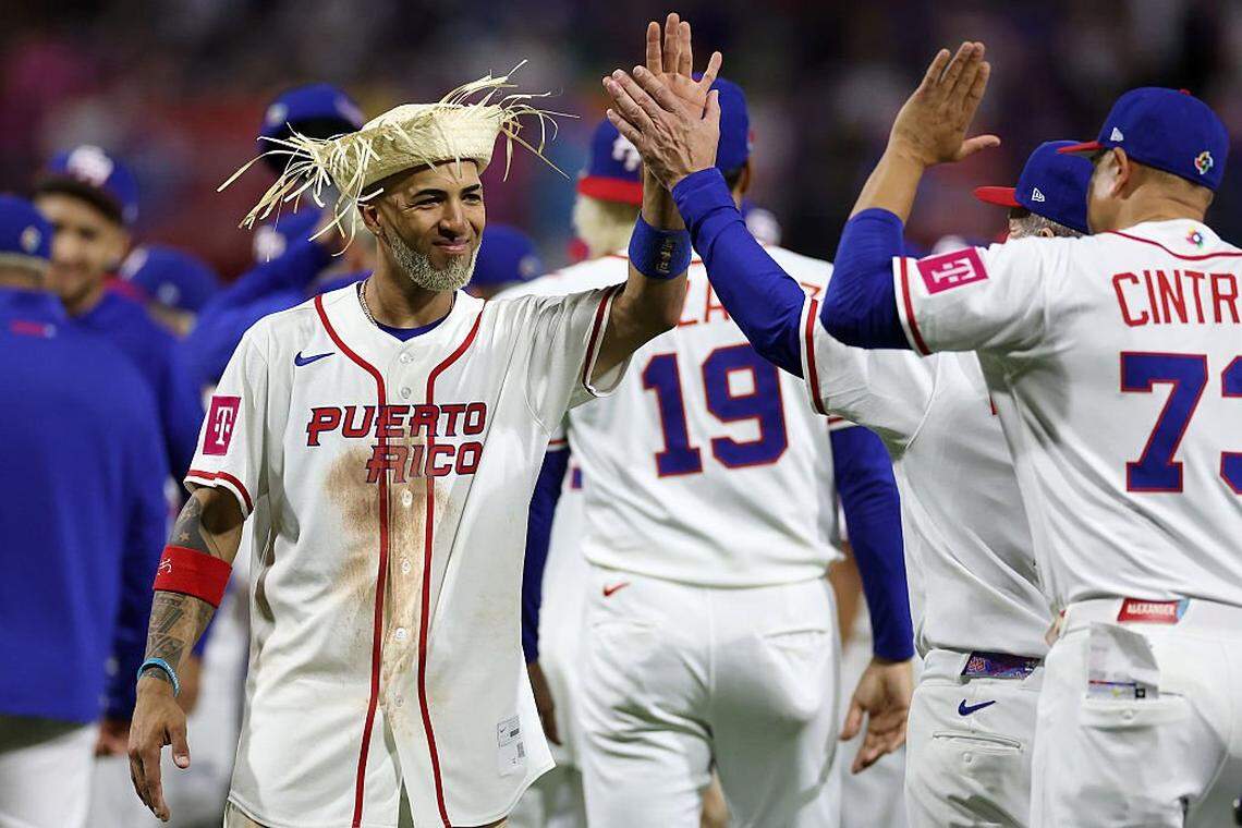 SAN JUAN, PUERTO RICO - MARCH 09: Eddie Rosario #17 of Team Puerto Rico celebrates with teammates a 4-1 victory against Team Cuba after the game during the 2026 World Baseball Classic at Hiram Bithorn Stadium on March 09, 2026 in San Juan, Puerto Rico. (Photo by Al Bello/Getty Images)