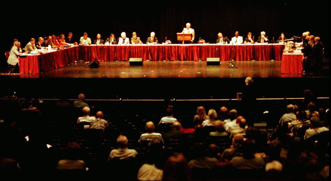 Panel members reviewing the state constitution in Panama City, Florida.