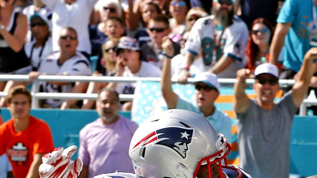 Miami Dolphins player Kenny Stills fails to catch a pass in the end zone as New England Patriots player Leonard Johnson defends at the beginning of the second quarter at Sun Life Stadium in Miami Gardens on Sunday, Jan. 3, 2016.