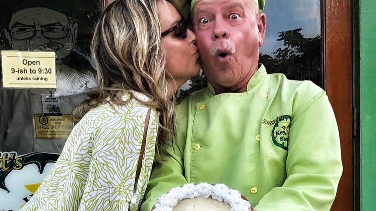 Pie shop owner Kermit Carpenter gets a kiss from an admirer outside his Key West business.