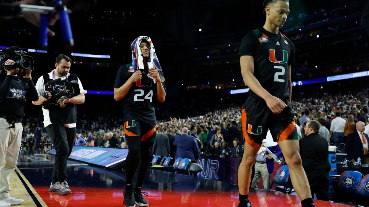 Miami Hurricanes players Isaiah Wong (2) and Nijel Pack (24) walk off the court after they were defeated 72-59 by the Connecticut Huskies during the Men’s Basketball Championship National Semifinal at NRG Stadium in Houston, Texas on Saturday, April 1, 2023.