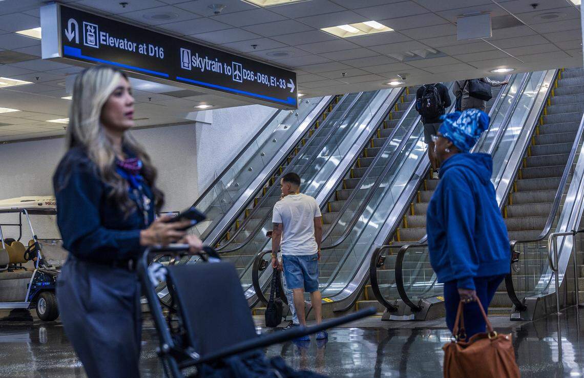 Passengers walked by the escalators heading to the MIA Skytrain recently opened Concourse D's station 1, as the Skytrain system service is fully restored ahead of Labor Day weekend in Miami, on Thursday, August 28, 2025.