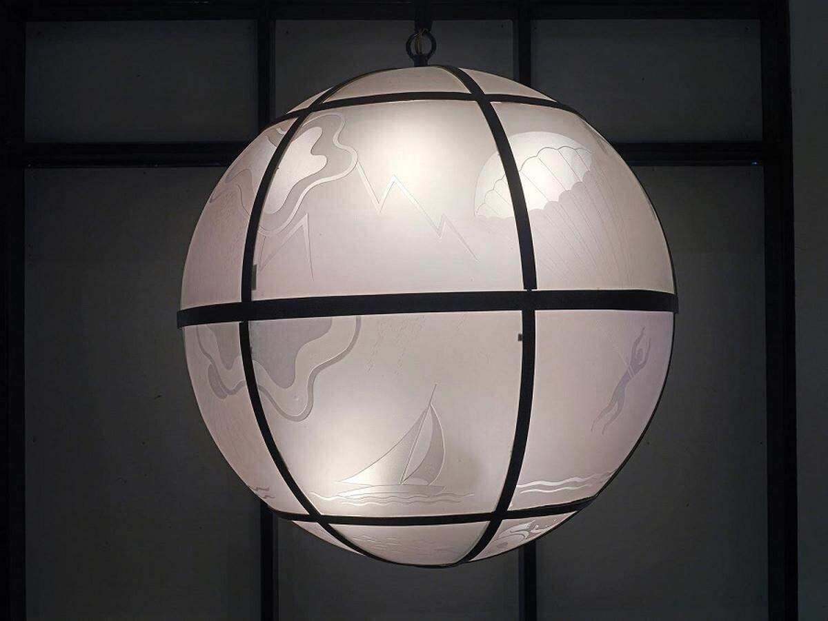 A chandelier (1937) by architect Kjell Westin for a restaurant in Stockholm, Sweden, has transportation images etched in glass. (Photo/Lynton Gardiner)