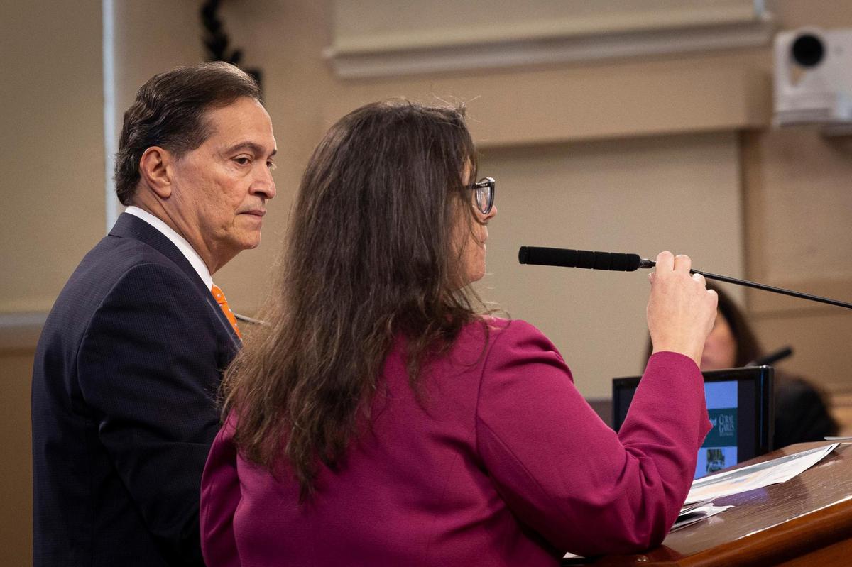 Jorge Duyos, the city’s hired consultant for annexation, left, listens to Diana Gomez, finance director, during a presentation about the potential annexation of Little Gables at a Coral Gables City Commission meeting on Tuesday, Nov. 14, 2023, at City Hall in Coral Gables.