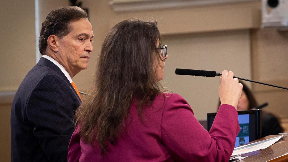 Jorge Duyos, the city’s hired consultant for annexation, left, listens to Diana Gomez, finance director, during a presentation about the potential annexation of Little Gables at a Coral Gables City Commission meeting on Tuesday, Nov. 14, 2023, at City Hall in Coral Gables.