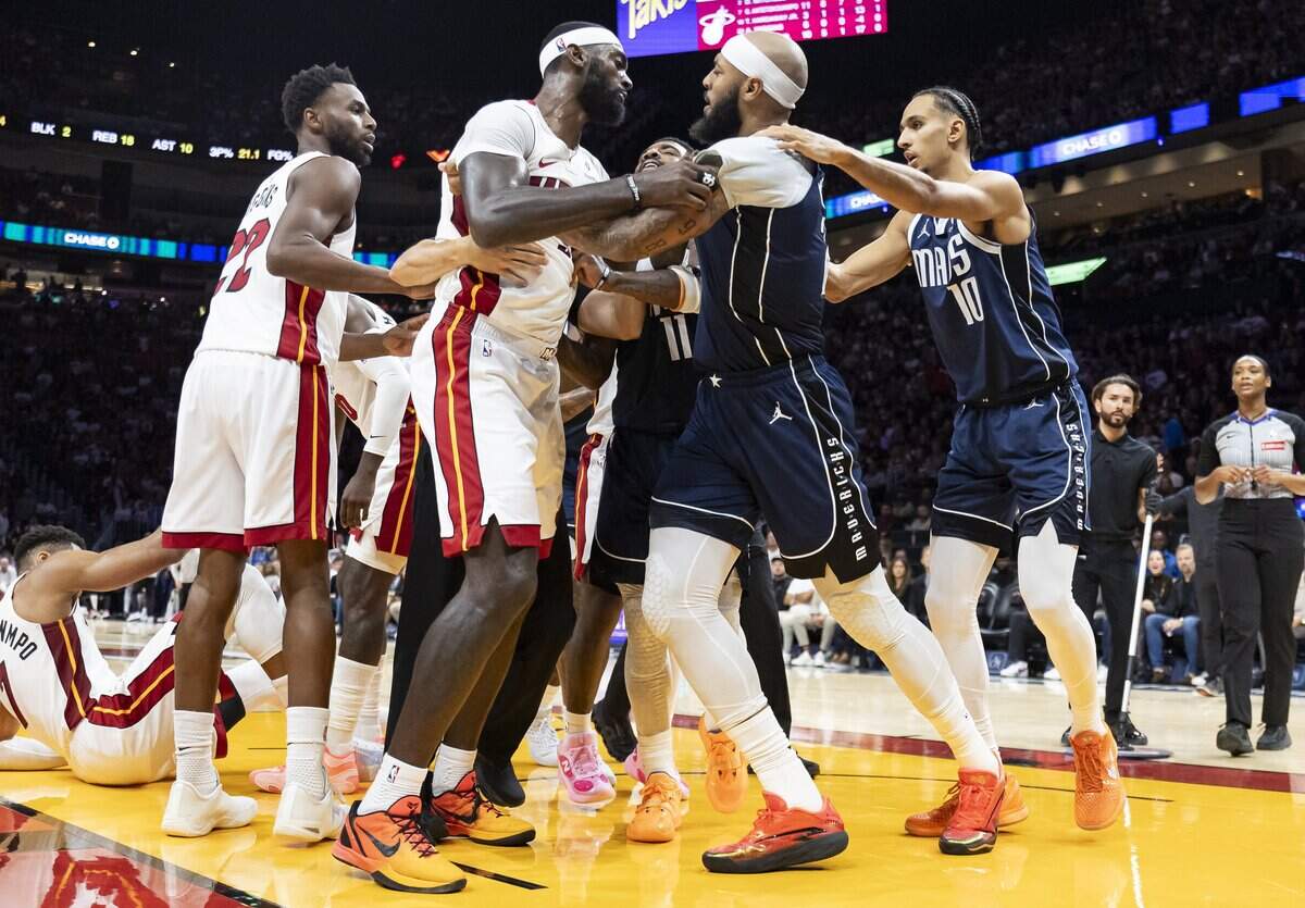 Miami Heat forward Bobby Portis (95) and Dallas Mavericks forward Daniel Gafford (21) get into an altercation after a play in the first half of their NBA game at the Kaseya Center on Monday, October 26, 2026, in downtown Miami, Fla.