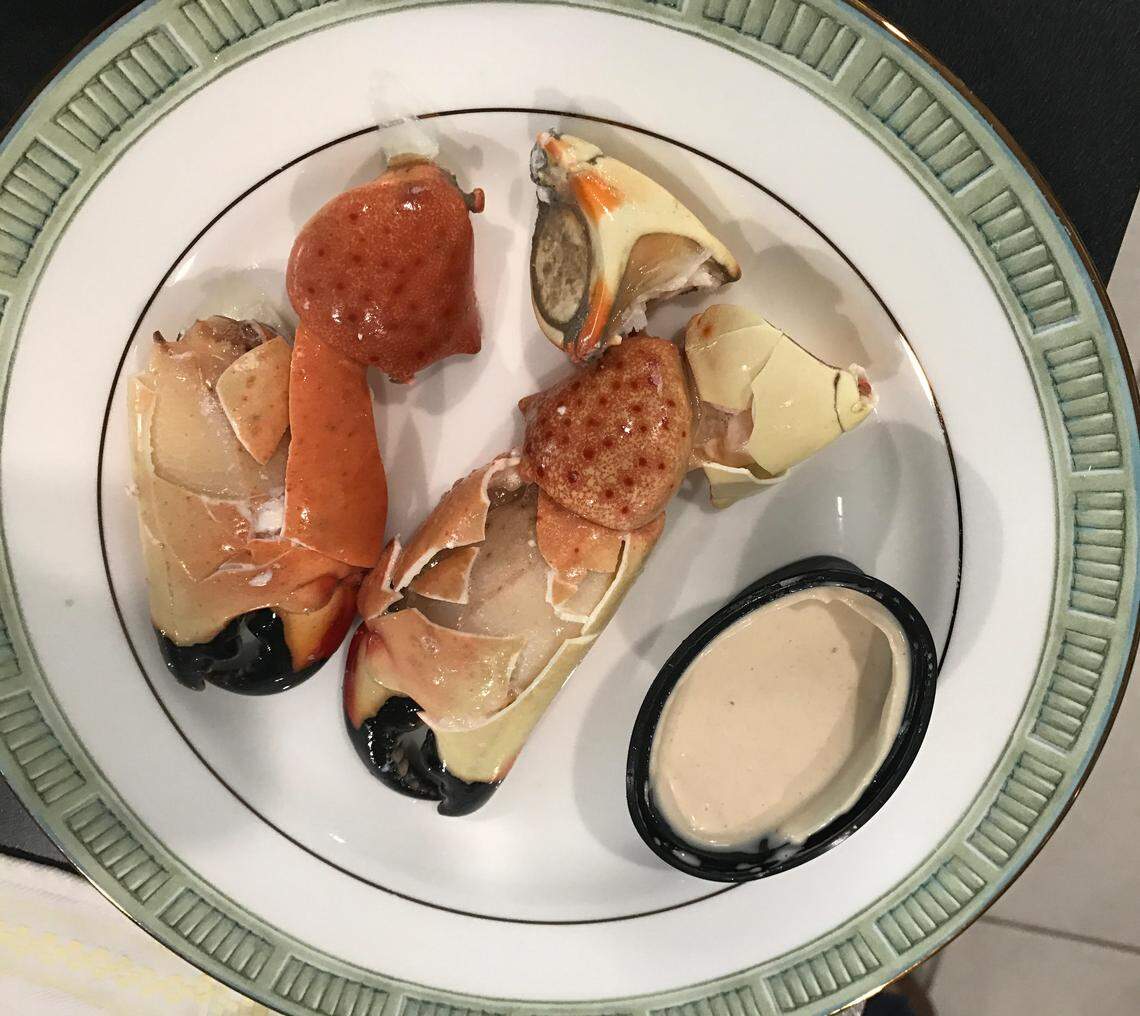 Cracked stone crabs are set on a plate in a South Florida kitchen.