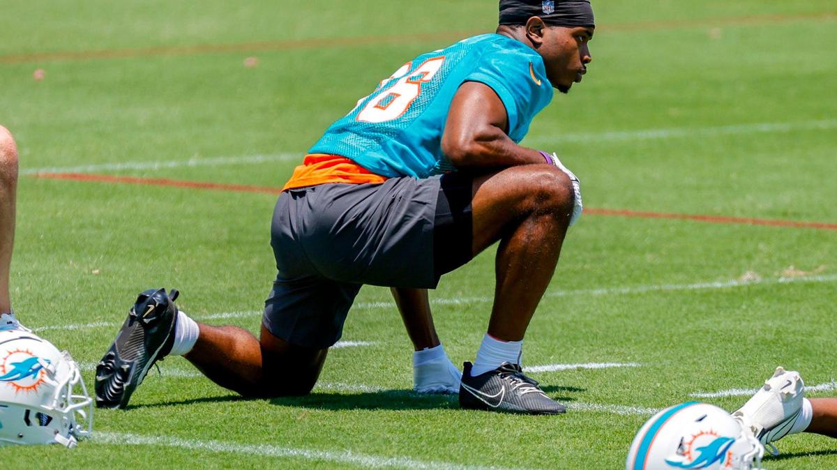 Miami Dolphins Storm Duck (36) stretches during practice.