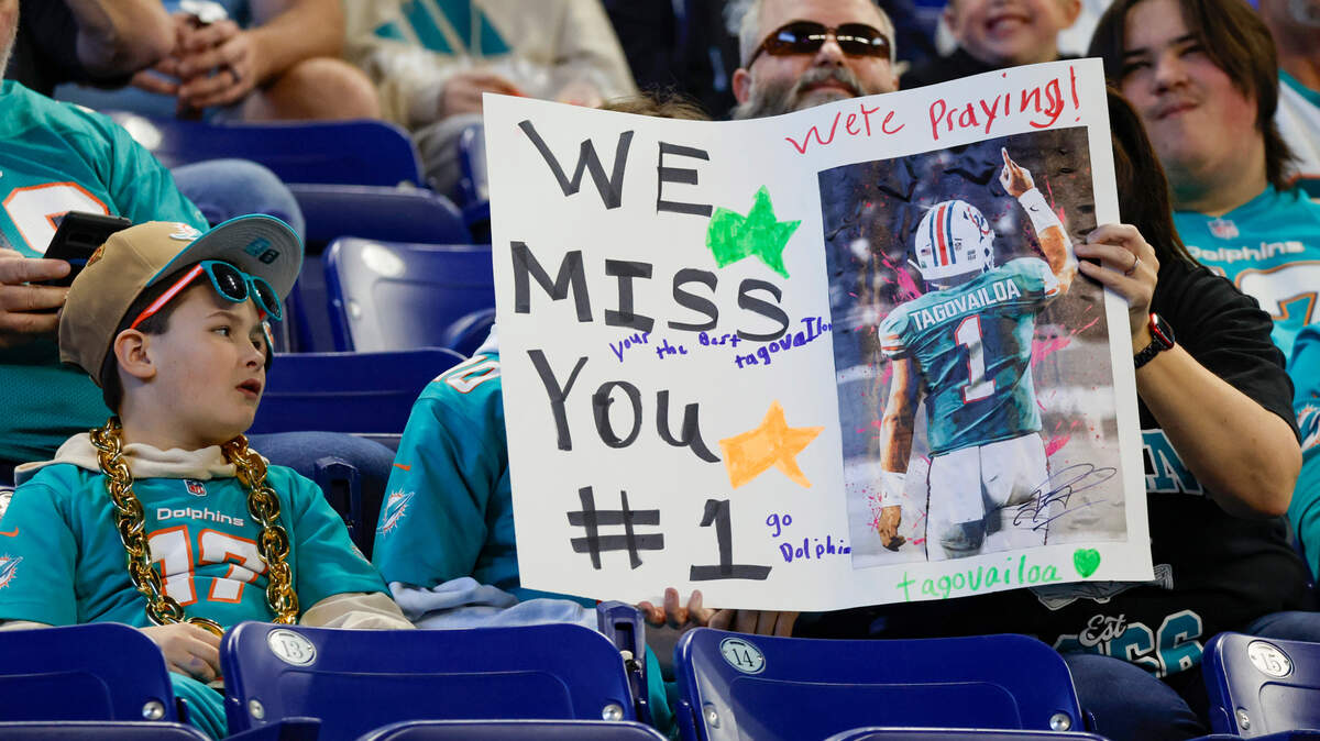 Dolphins fans show their support for Miami Dolphins quarterback Tua Tagovailoa (1) during an NFL football game against the Indianapolis Colts in Indianapolis, Indiana on Sunday, October 20, 2024.