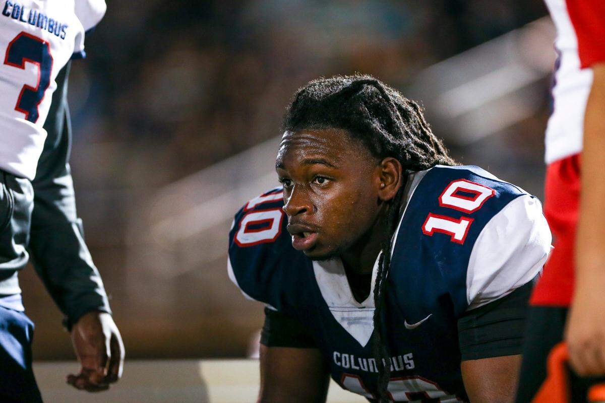 Columbus Explorers middle linebacker Hector Chavez (10) looks on from the bench after returning the football for a touchdown during the second quarter of a high school football playoff game against the Palmetto Panthers at Tropical Park in Miami, Florida, Friday, November 18, 2022.