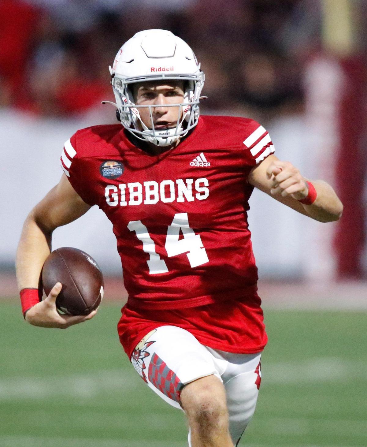Cardinal Gibbons Chiefs quarterback Michael Merdinger (14) runs the ball against Cardinal Gibbons Crusaders (NC) during the Broward County National Football Showcase on Friday, August 25, 2023 at Cardinal Gibbons High in Fort Lauderdale. Andrew Uloza / for Miami Herald