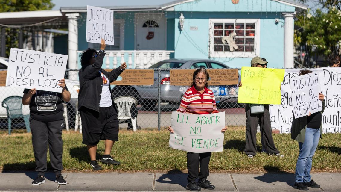 Gudelia Platt, center, participates in a protest near one of the entrances to the Li’l Abner Mobile Home Park on Saturday, Dec. 21, 2024, in Sweetwater, Florida. All 900-plus mobile homeowners were notified by the park’s owner, CREI Holdings, that the park will permanently close on May 19, and residents must vacate the premises by then, with or without their homes.
