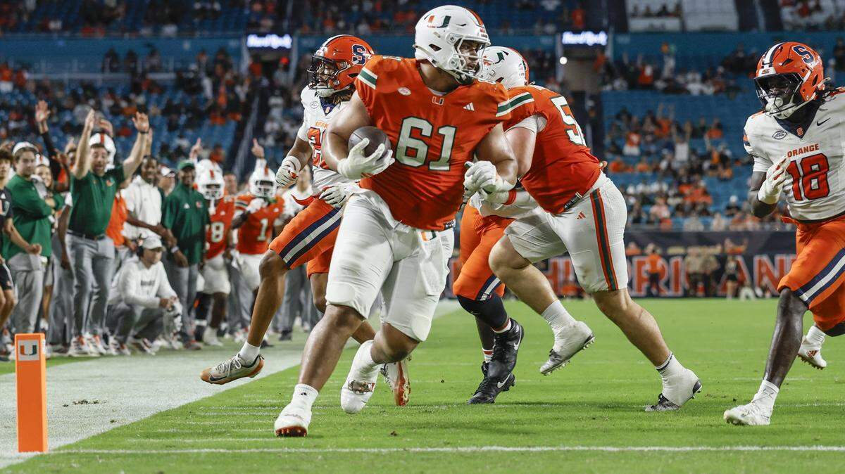 Miami Hurricanes offensive lineman Francis Mauigoa (61) scores in the second half of an NCAA football game against the Syracuse Orange at Hard Rock Stadium in Miami Gardens, Florida on Saturday, November 8, 2025.