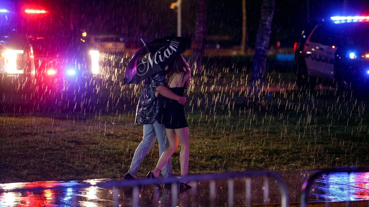 A downpour dampens spring break party before midnight curfew on Miami Beach, Florida on Saturday, March 16, 2024.
