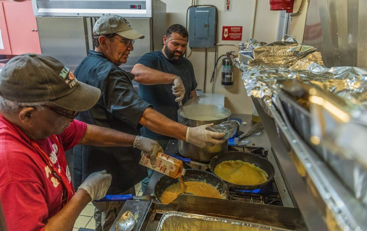 Volunteers from left, Elder Cooper, John Barker and Adam Arnaout, prepare breakfast for a food drive hosted by Nourish Miami, a Miami-based food recovery organization, at the Greater Bethel African Methodist Episcopal Church in Overtown, Miami, on Friday, June 5, 2026.