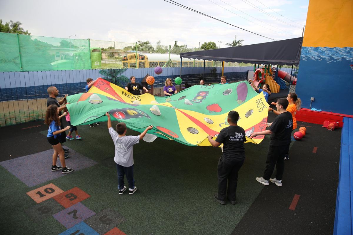 Students and teachers in the Fit Kids of America after-school program enjoy a game that helps them learn about nutrition Friday afternoon, Oct. 12, 2018.