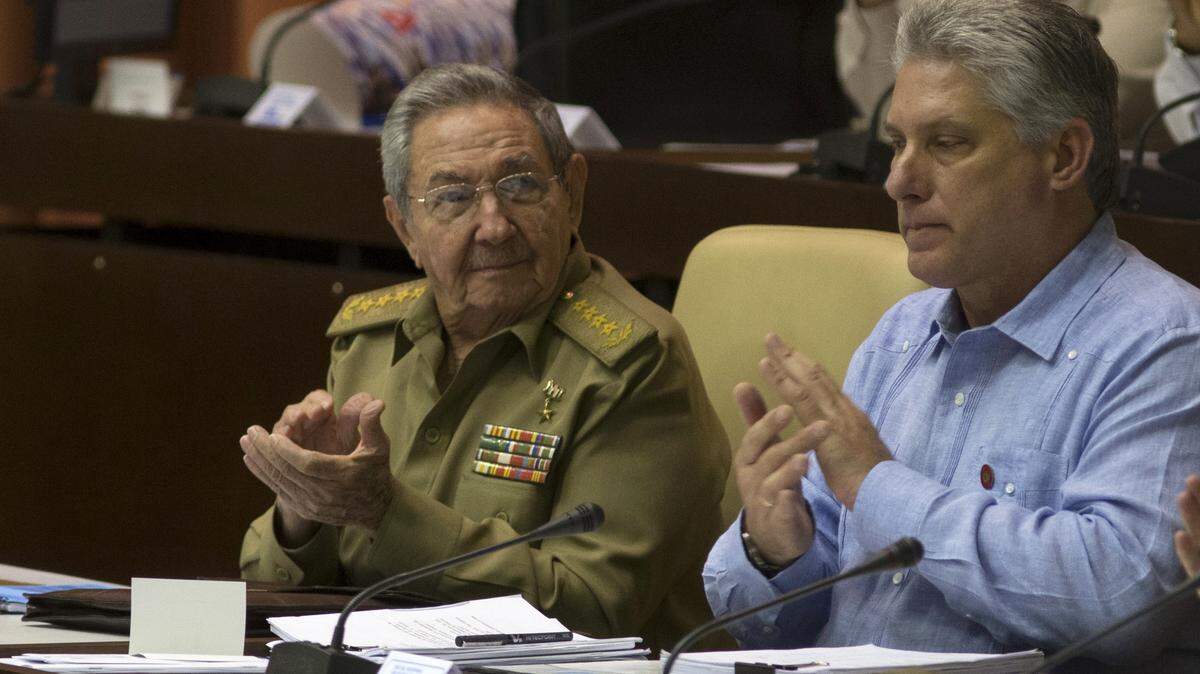 Cuba’s former President Raul Castro applauds as he sits next to Miguel Díaz-Canel during a previous session of the island’s National Assembly. The National Assembly, Cuba’s parliament, met Saturday and approved the Council of Ministers that will serve under Díaz-Canel.