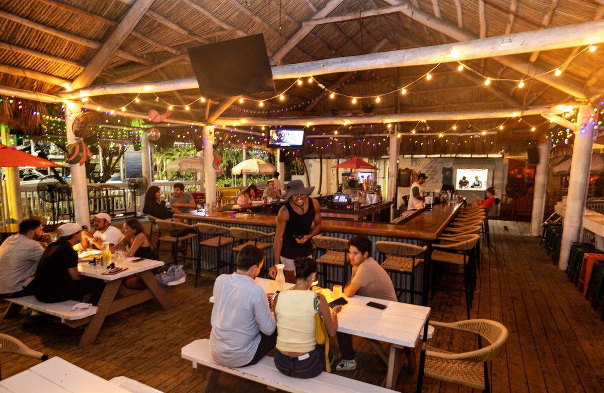 Guests dine and drink at Gramps Getaway on Wednesday, September 3, 2025, in Key Biscayne, Fla.