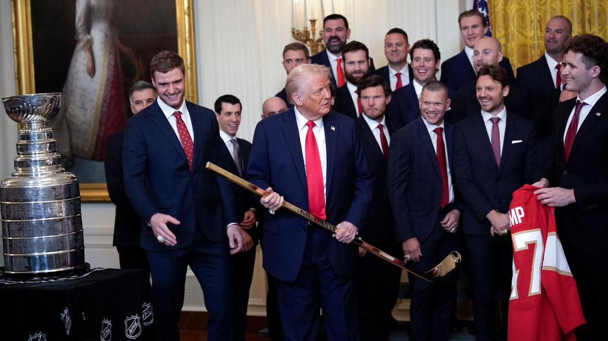 President Donald Trump is presented a stick and from the Florida Panthers NHL hockey team to celebrate their 2024 Stanley Cup win at the White House in Washington on February 3, 2025.