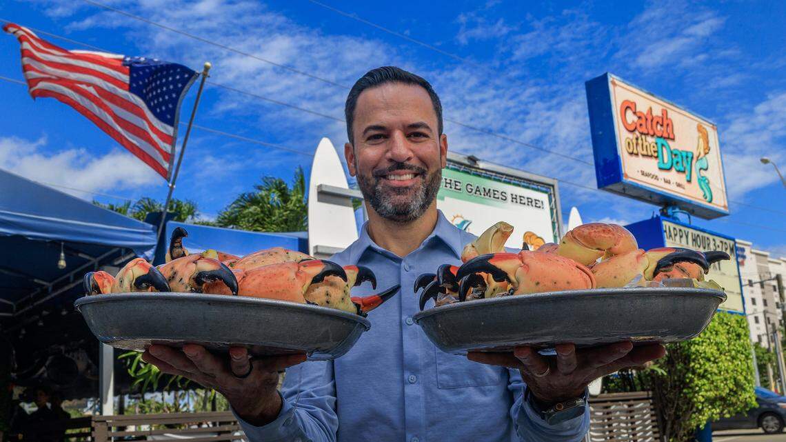 Owner Eric Castellanos displays a couple Stone Crab trays, ahead of the beginning of the Stone Crab season at the iconic Catch of the Day Restaurant on Lejeune Avenue in Miami, on Tuesday October, 14 2025.