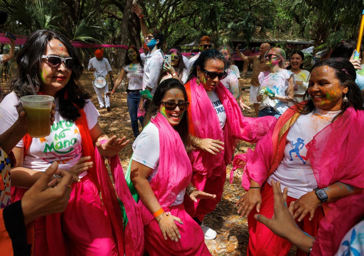 Miami Jhankar, am Indian dance group, dance to the Dhol drums during the celebration of Holi, the Hindu festival of colors, on Sunday, March 16, 2025, at Kendall Indian Hammocks Park in Miami, Fla.
