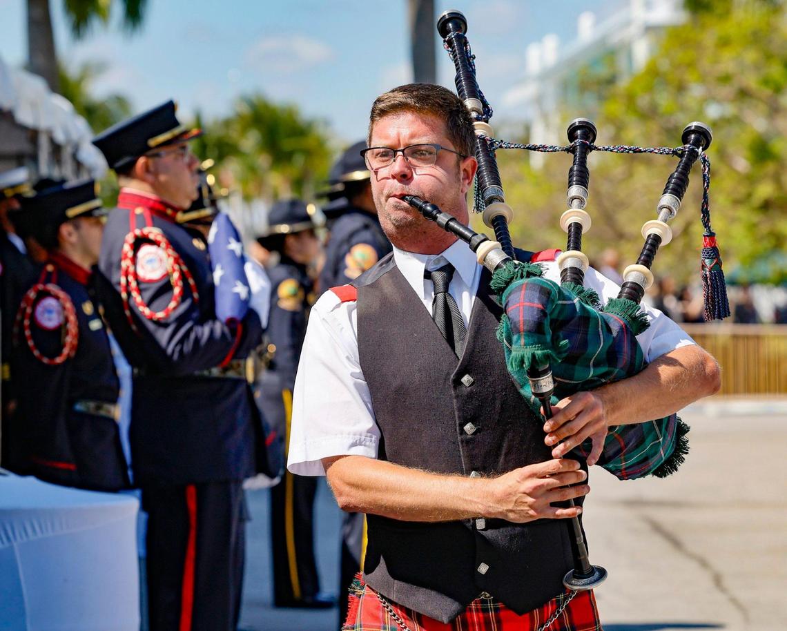 Jason Wright plays a bagpipe as a memorial service begins for Miami City Commissioner Manolo Reyes at Miami City Hall on Wednesday, April 16, 2025.