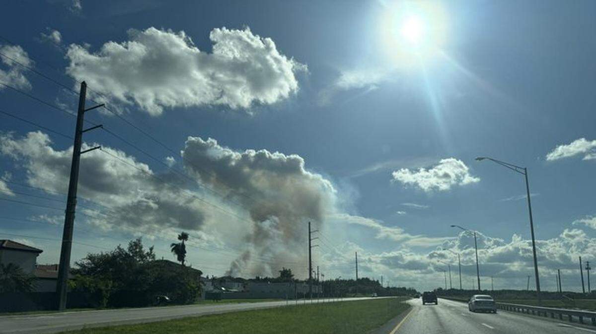Firefighters are battling a grass fire in West Kendall, which has affected 120 acres. Authorities are warning nearby residents of smoky conditions.