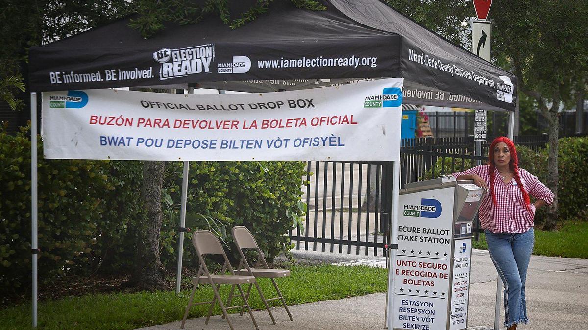 A election worker stands next to the ballot intake station at the Little Haiti Cultural Center in Miami, Florida, on Aug. 5, the first day of early voting for the Aug. 20 primary election. Early voting runs from Aug. 5 through Aug. 18, 2024, at 23 polling sites across Miami-Dade County. Election Day for the primary is Aug. 20.