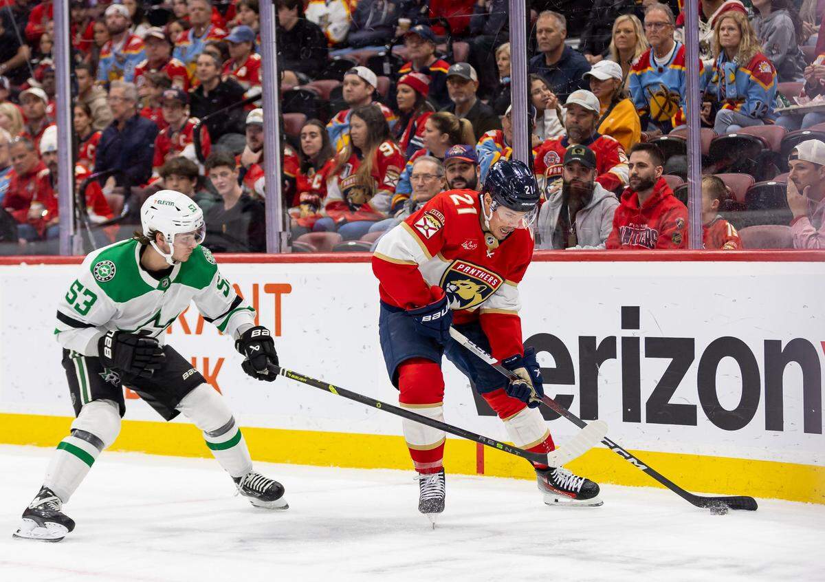 Florida Panthers center Nick Cousins (21) and Dallas Stars center Wyatt Johnston (53) compete for the puck in the first period of their NHL game at the Amerant Bank Arena on Wednesday, Dec. 6, 2023, in Sunrise, Fla.