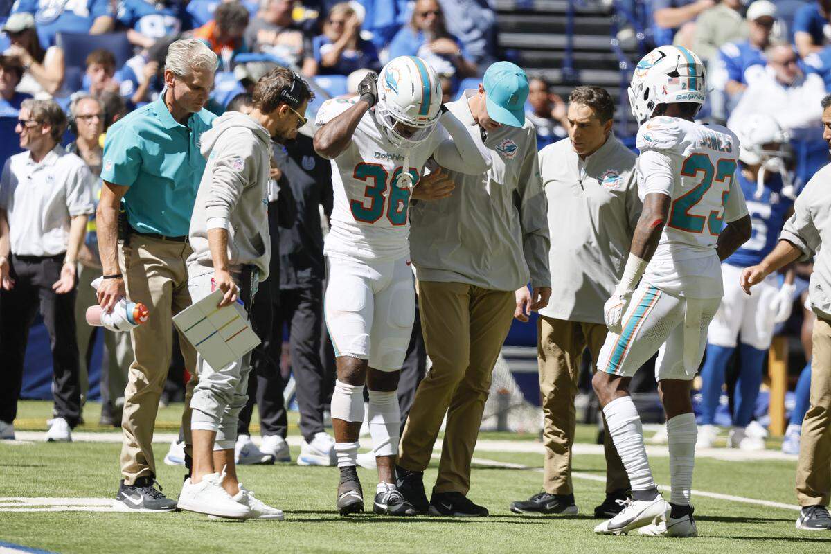 Miami Dolphins cornerback Storm Duck (36) receives medical attention after sustaining an injury during the first half of an NFL game against the Indianapolis Colts at Lucas Oil Stadium on Sunday, Sept. 7, 2025, in Indianapolis, Indiana.