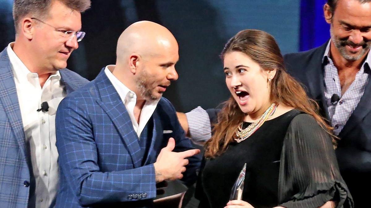 PitBull congratulates Danya Sherman, founder and CEO KnoNap, winner of the eMerge Americas 2019 Shark Tank startup competition, Miami Beach, Florida, Tuesday, April, 30, 2019.
