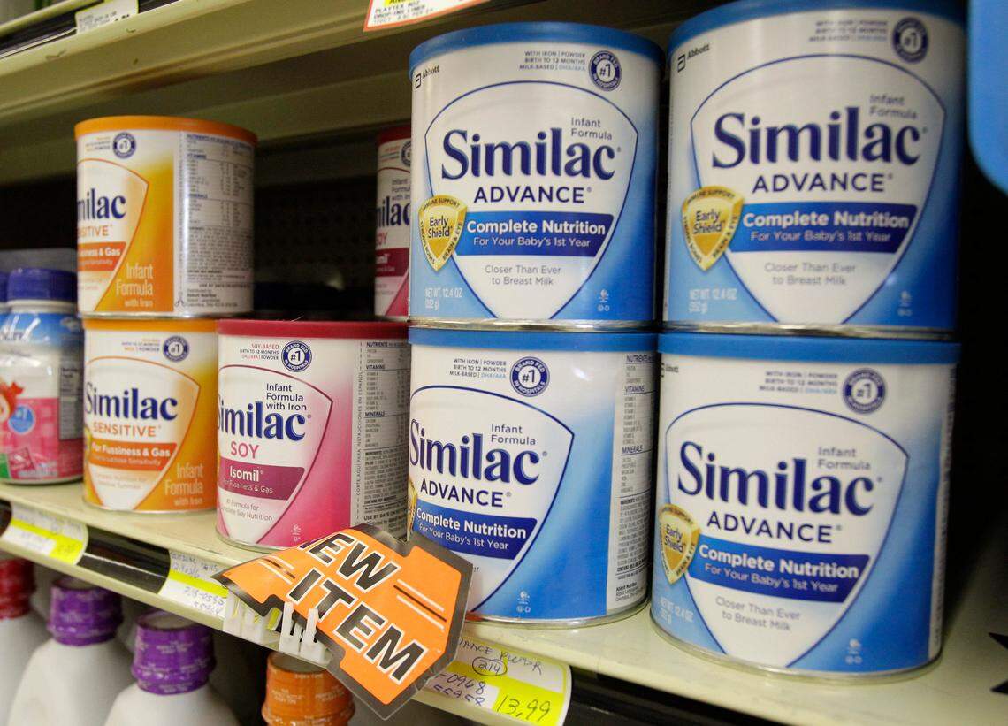FILE - In this Tuesday, July 19, 2011, file photo, Similac baby formula is displayed on the shelves at Shaker’s IGA in Olmsted Falls, Ohio. Abbott Laboratories announced Monday, Feb. 1, 2016, that it is buying Alere for $5.8 billion as it tries to expand its medical diagnostics business. Alere makes tests used to diagnosis the flu, HIV, malaria and several other diseases. Abbott makes drugs, infant formula and medical devices. (AP Photo/Mark Duncan, File)