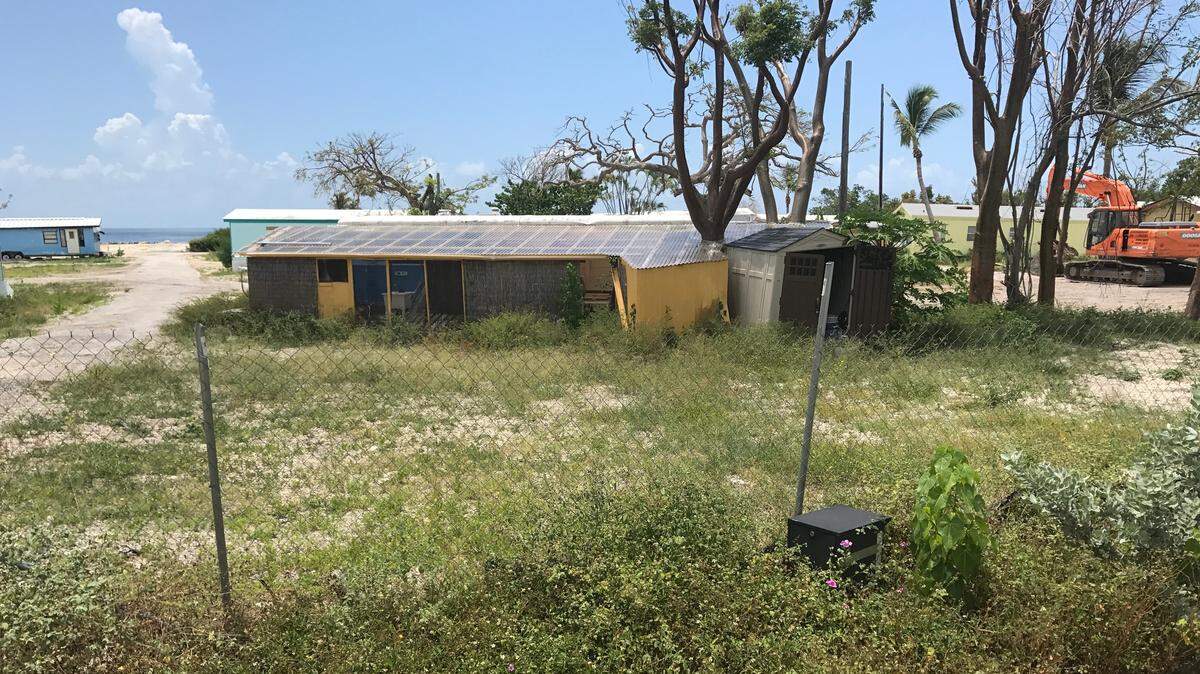 The remains of trailers destroyed by Hurricane Irma sit behind a chain-link fence this month at mile marker 87.4 in Islamorada. The trailers are expected to be replaced by a mix of small, manufactured homes and RVs.