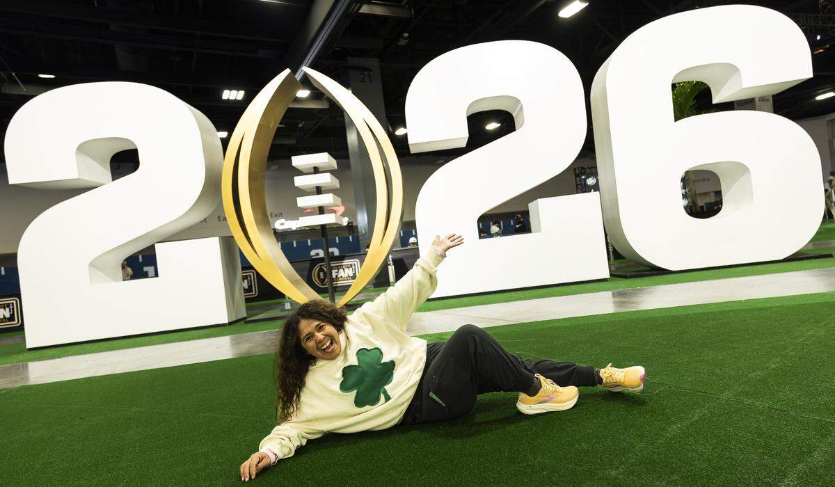 Tizlia Orozco strikes a pose as she visits the Playoff Fan Central at the Miami Beach Convention Center on Friday, Jan. 16, 2025, in Miami Beach, Fla. Fans can visit the event ahead of the College Football Playoff National Championship Game between the Miami Hurricanes and the Indiana Hoosiers and enjoy a variety of family-friendly interactive experiences.