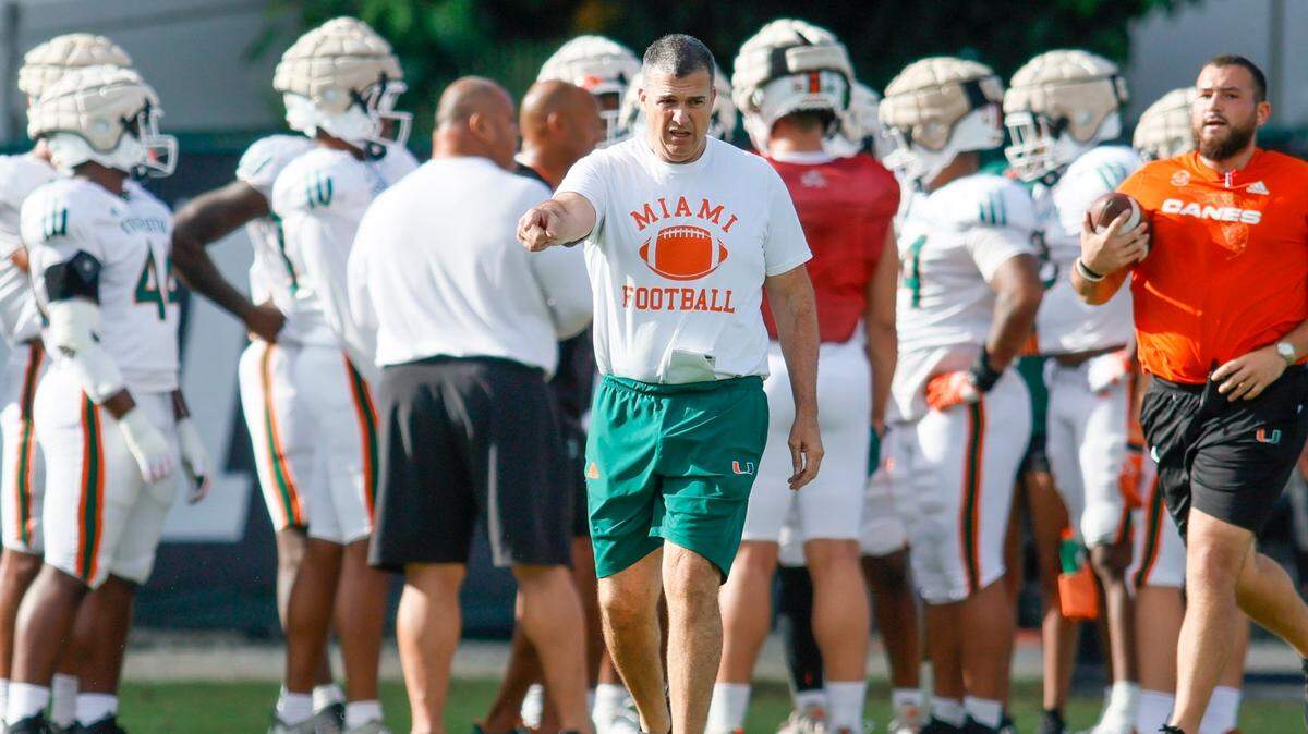 Miami Hurricanes head coach Mario Cristobal signals during football practice at the University of Miami campus in Coral Gables, Florida, Thursday, March 23, 2023.