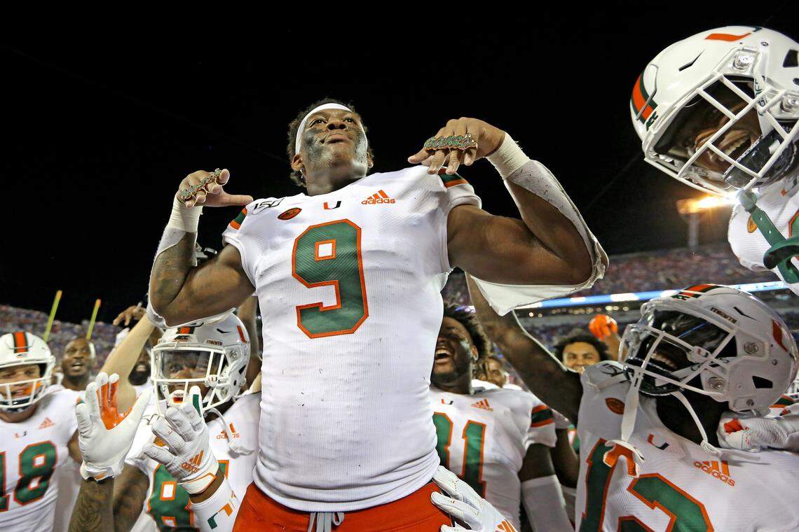 Miami Hurricanes tight end Brevin Jordan (9) wears the touchdown rings after scoring in the second quarter as the University of Miami plays the University of Florida at Camping World Stadium in Orlando on Saturday, August 24, 2019.