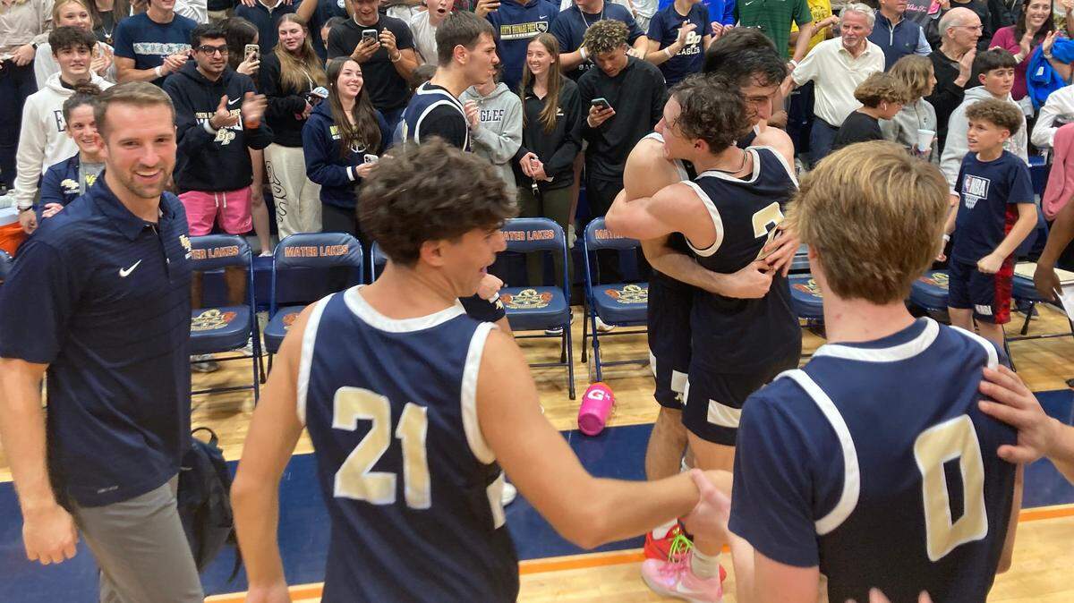 North Broward Prep players celebrate following their victory over Mater Lakes in the Region 4-4A boys’ basketball final on Friday at Mater Lakes.