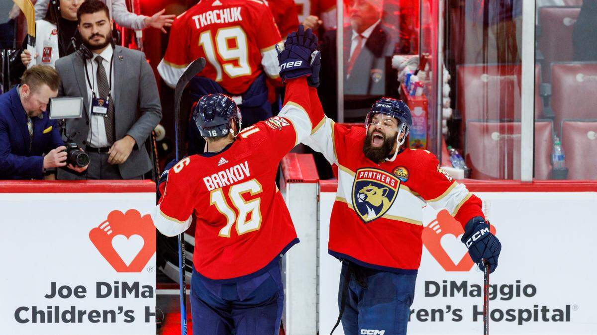 Florida Panthers players Radko Gudas (7) and Aleksander Barkov (16) celebrates their 7-2 win over the Montreal Canadien during an NHL game at FLA Live Arena on Thursday, December 29, 2022 in Sunrise, Fl.